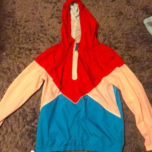 It’s a red, cream and blue windbreaker